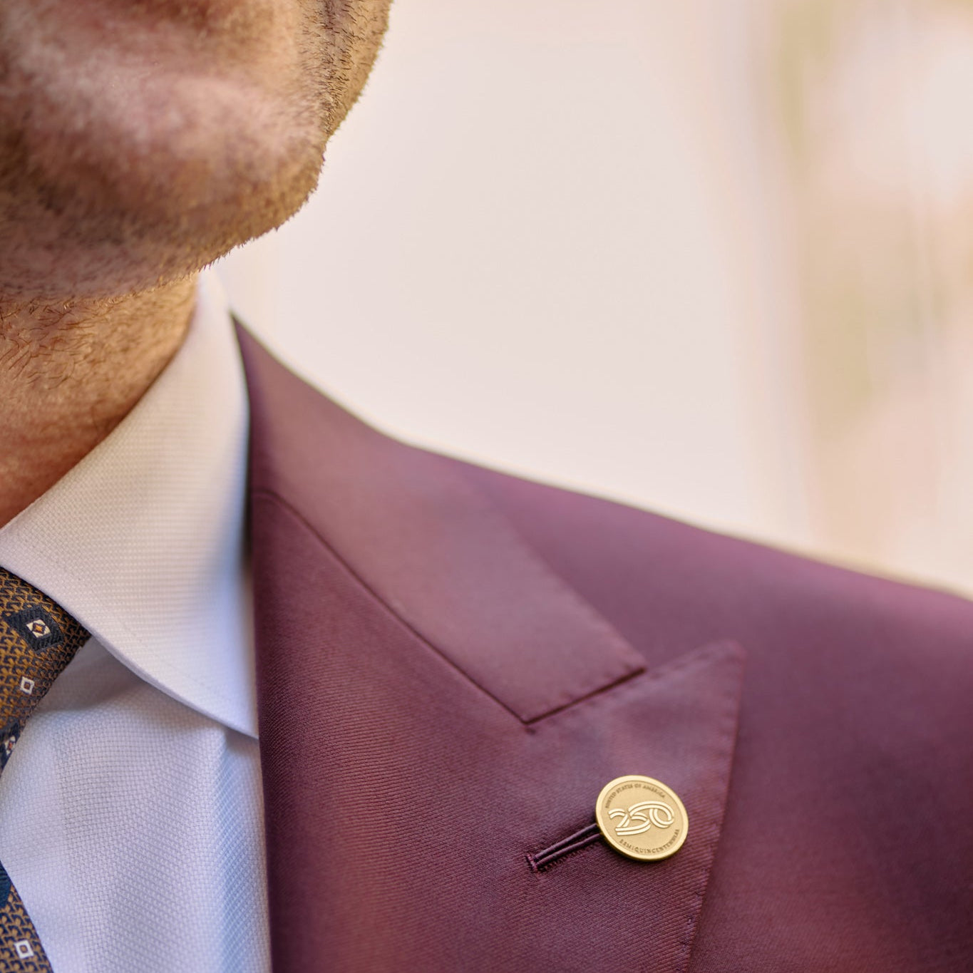 14K gold America250™ lapel pin featuring the official America250 logo, luxury commemorative jewelry honoring 250 years of American history.