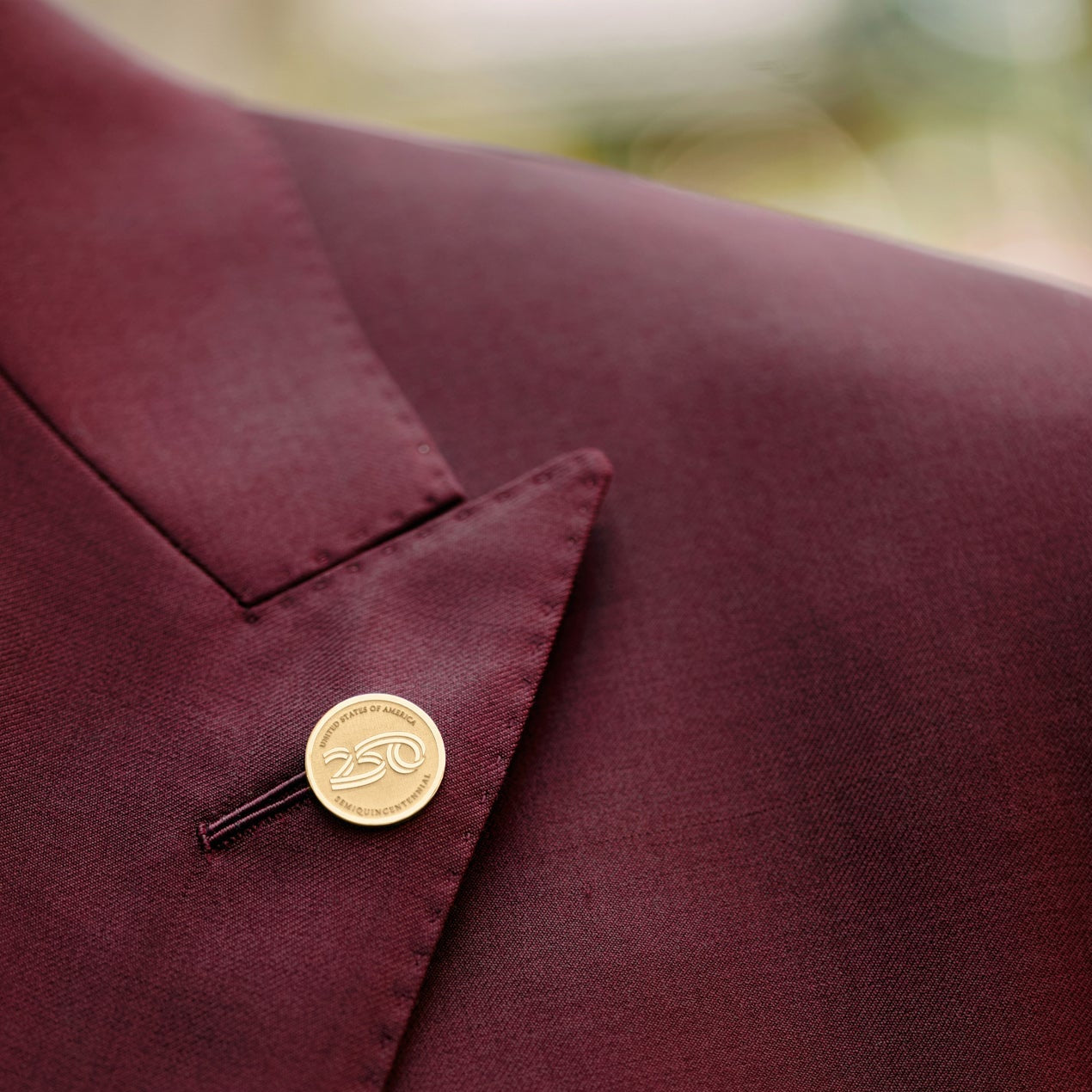 Official America250™ 14K gold lapel pin featuring the America250 logo, licensed commemorative fine jewelry celebrating America&