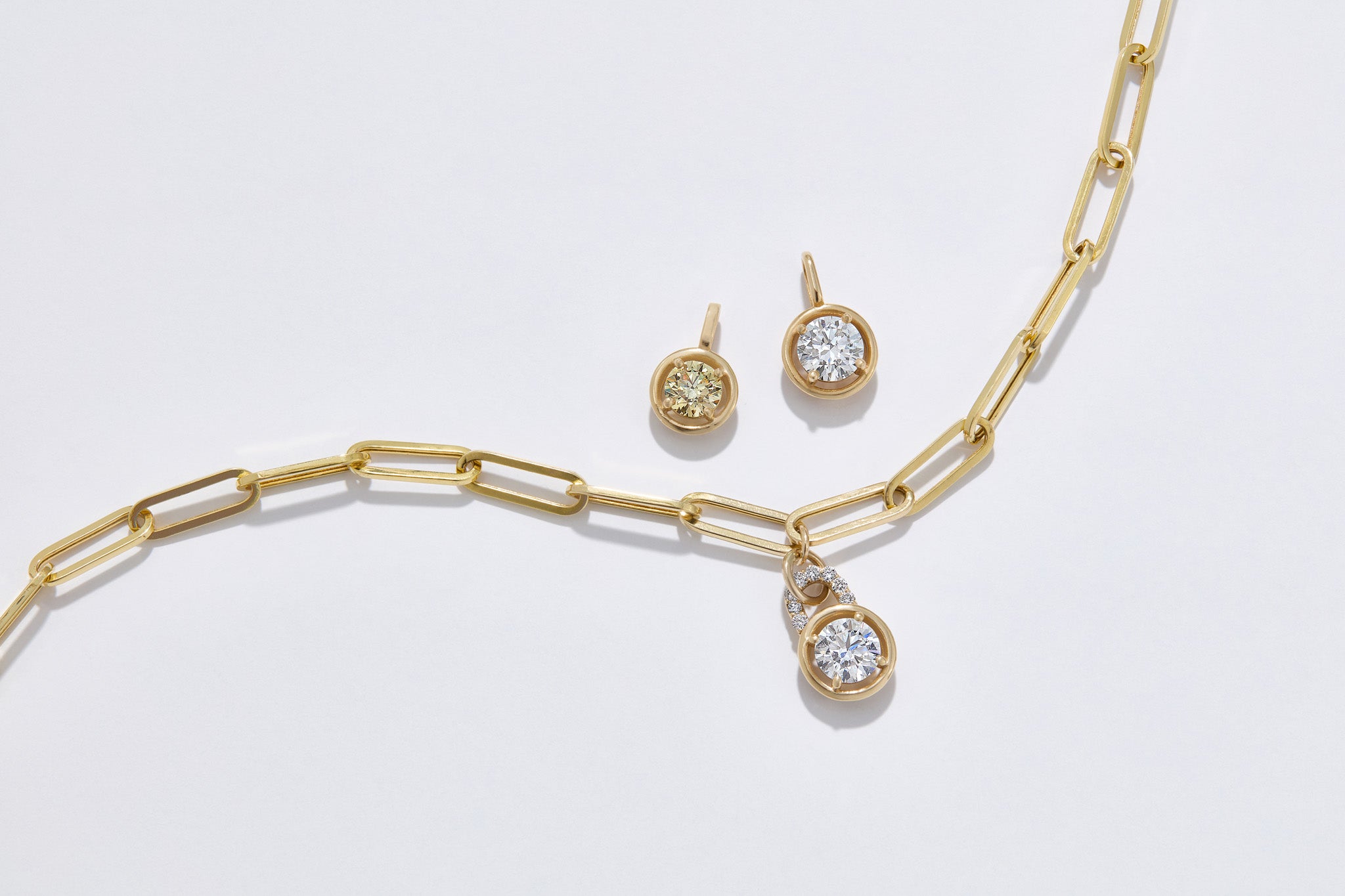 Our collection of round lab grown diamond pendants set in 14k Gold