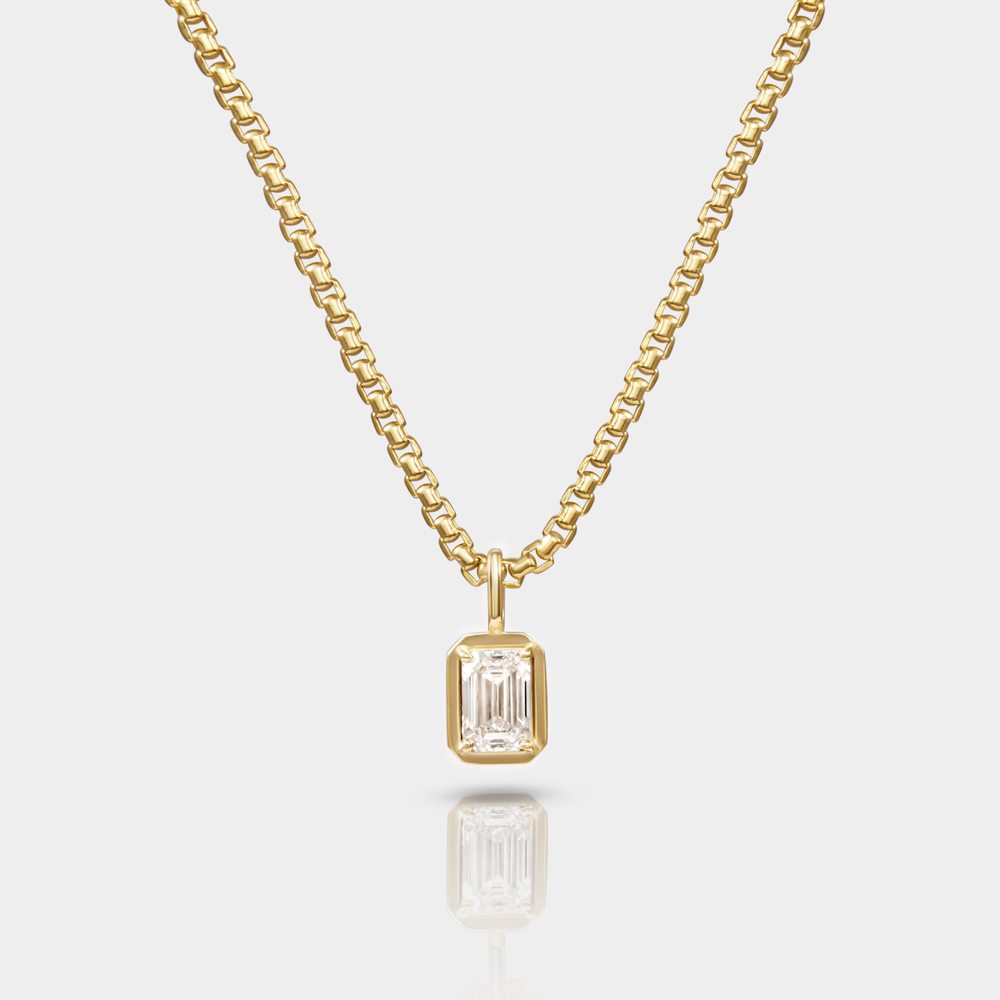A necklace with a 14k Yellow gold Box Chain