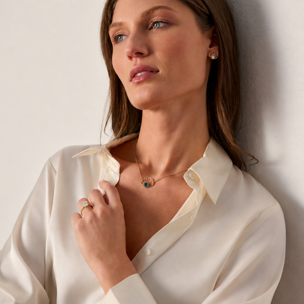 Bayside Scallop London Blue Topaz Necklace, showing the scallop design and London blue topaz worn on model
