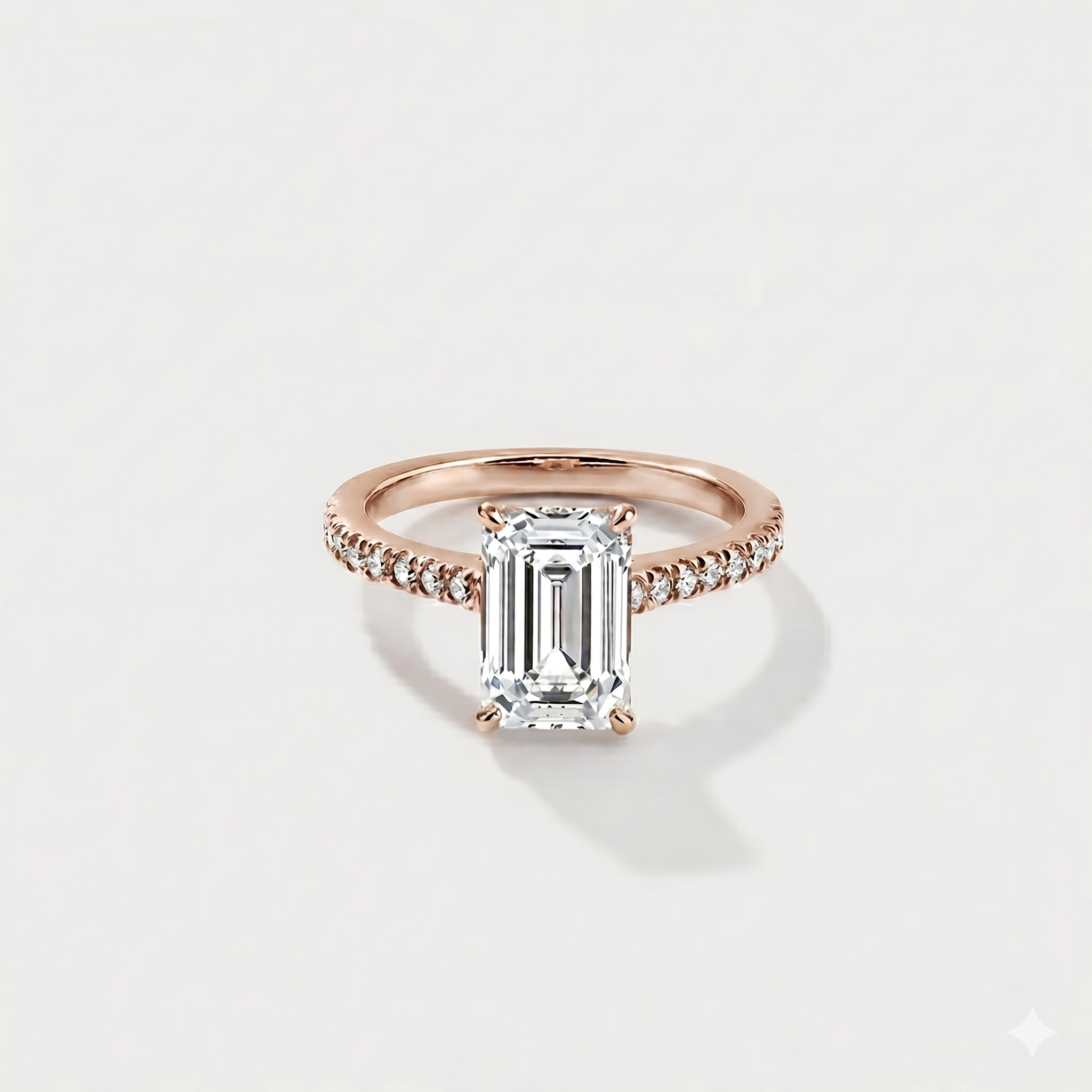 Emerald cut cathedral halo lab-grown diamond engagement ring in 14K rose gold by Cove Fine Jewelry