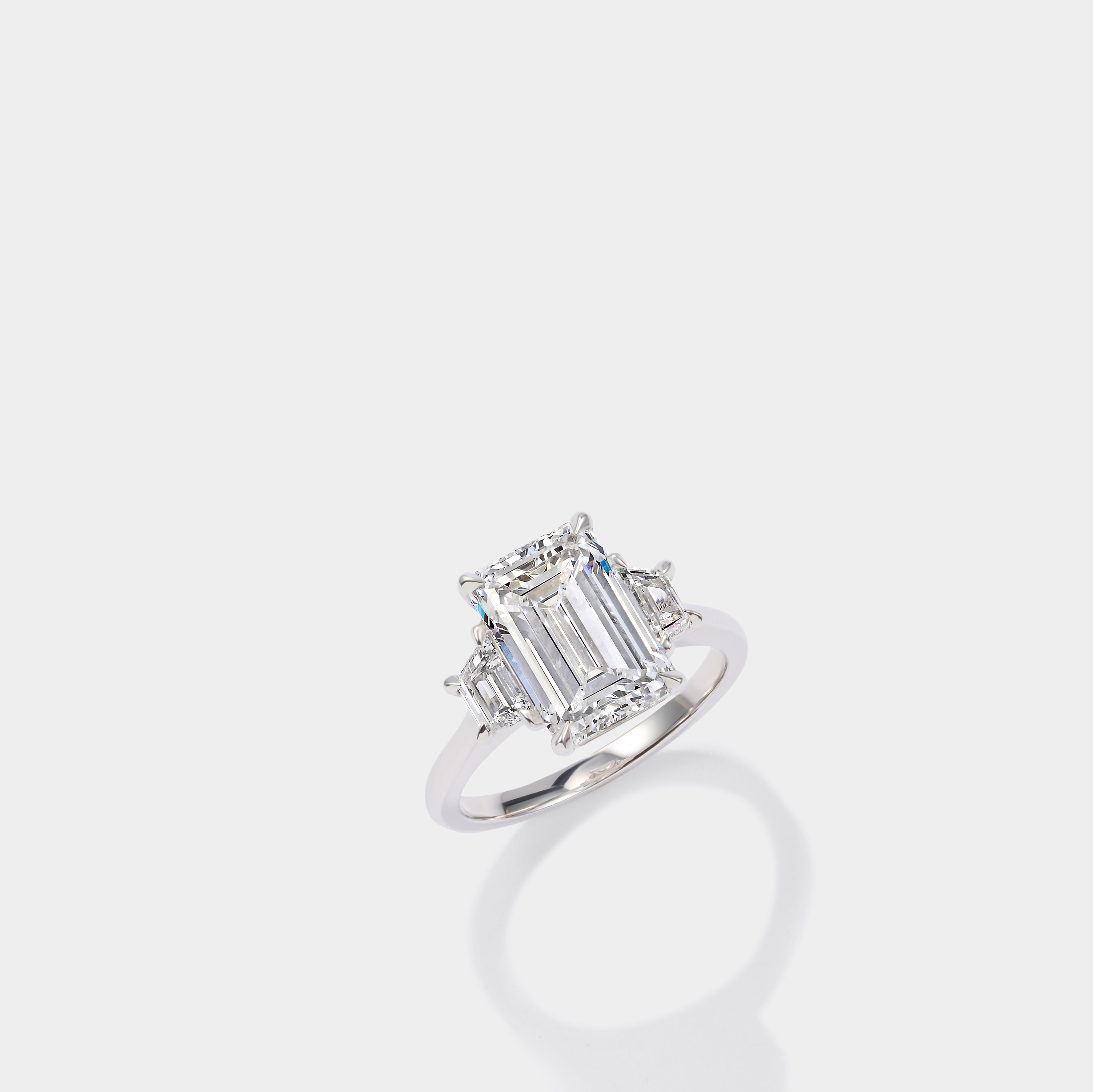 Emerald cut three stone lab-grown diamond engagement ring in 14K yellow gold by Cove Fine Jewelry