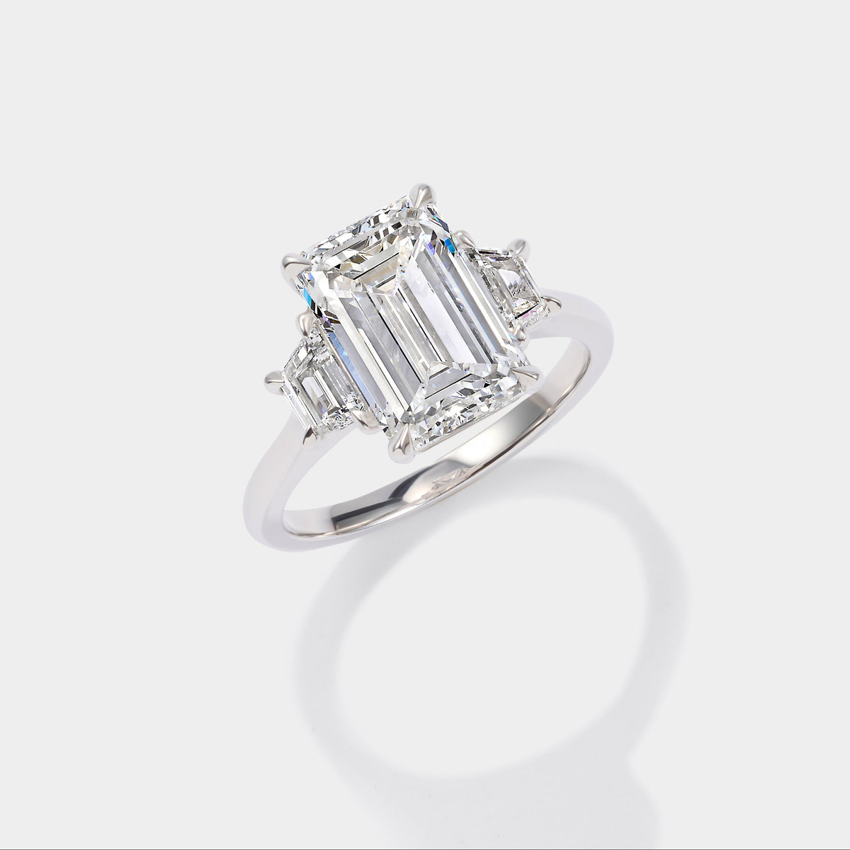 Emerald cut three stone lab-grown diamond engagement ring in 14K yellow gold by Cove Fine Jewelry