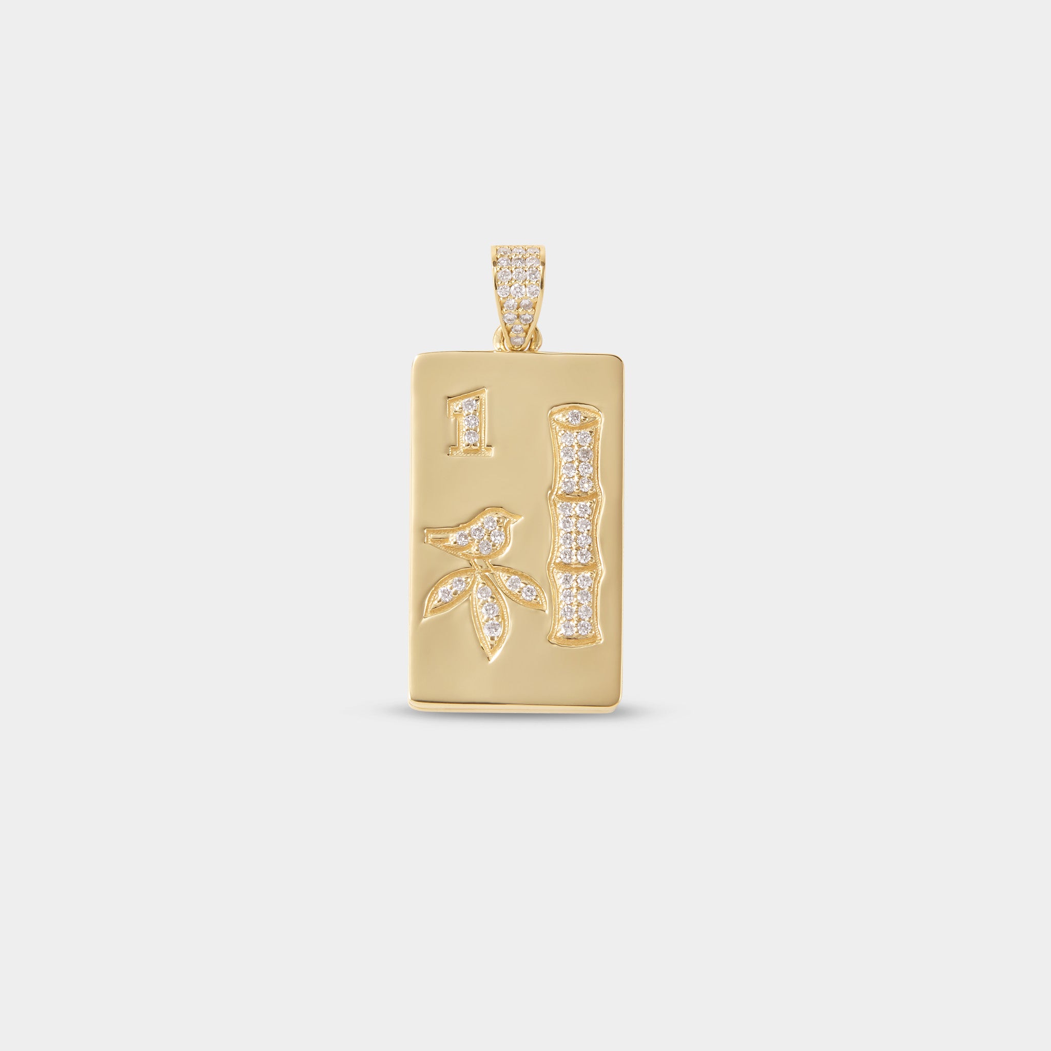 Diamond mahjong pendant necklace photographed on neutral background for luxury jewelry campaign