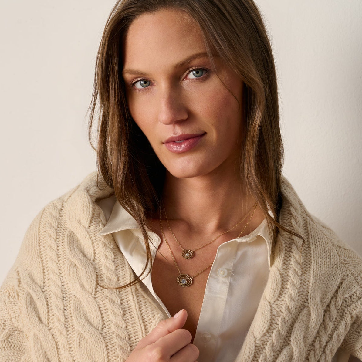 Model wearing our 14K gold oyster pearl necklace layered with our oyster diamond necklace