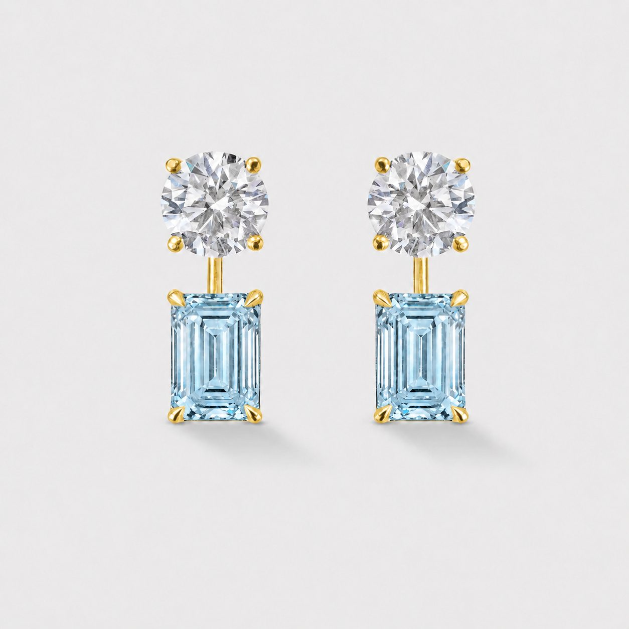 Natural emerald-cut aquamarine earrings crafted in 14k yellow gold