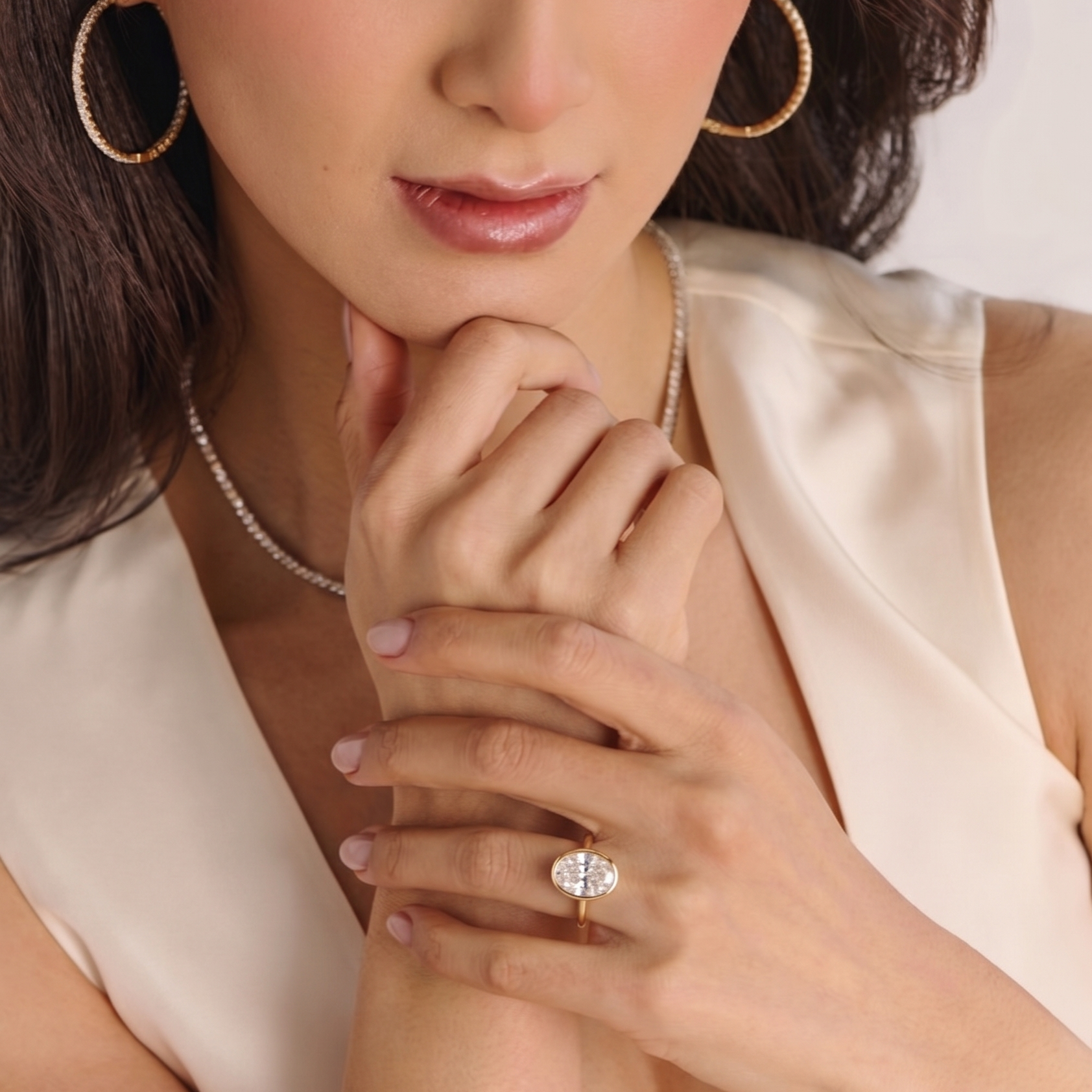 Close-up of oval bezel solitaire lab-grown diamond engagement ring setting