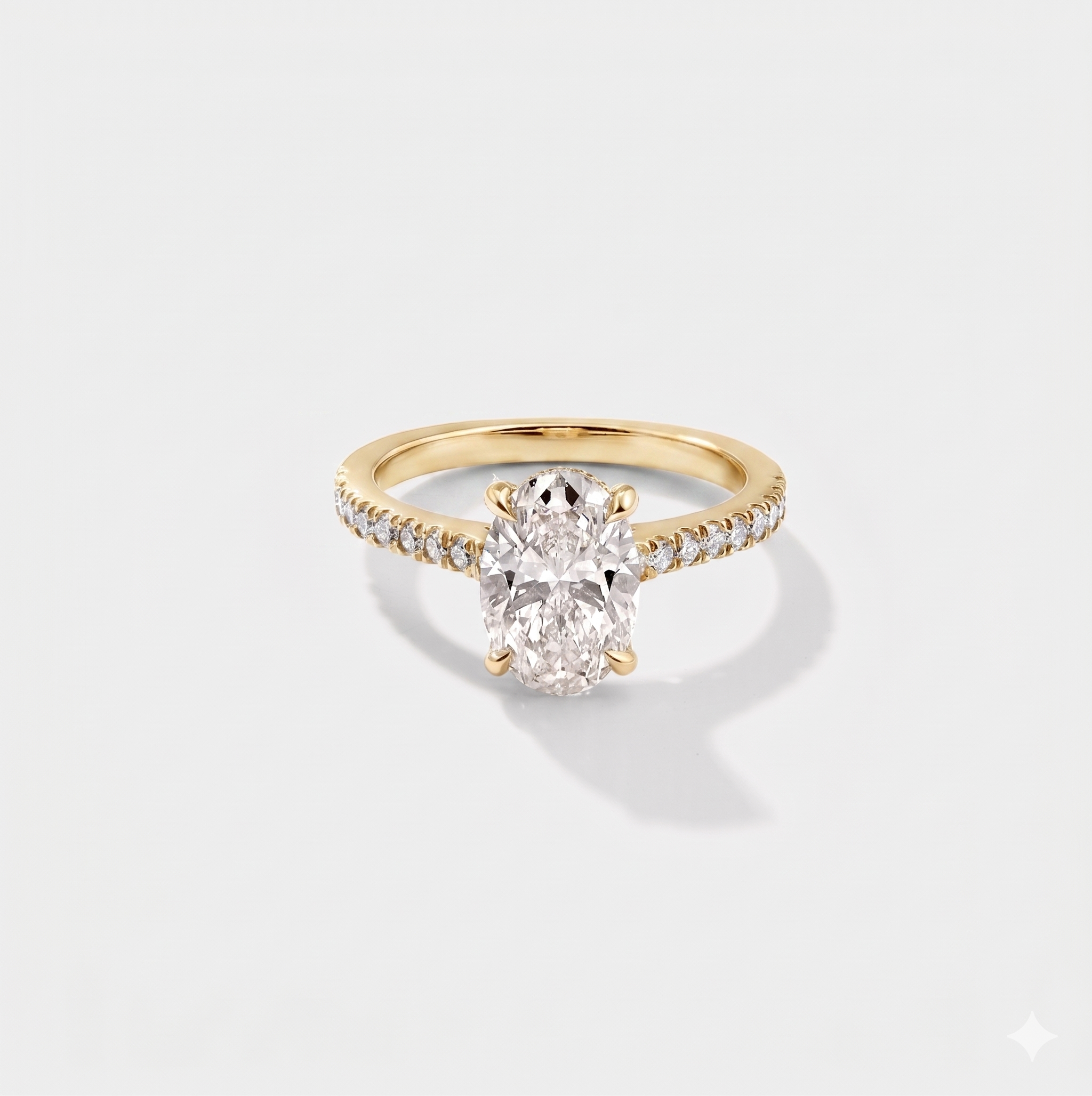 Oval cathedral halo lab-grown diamond engagement ring in 14K yellow gold by Cove Fine Jewelry