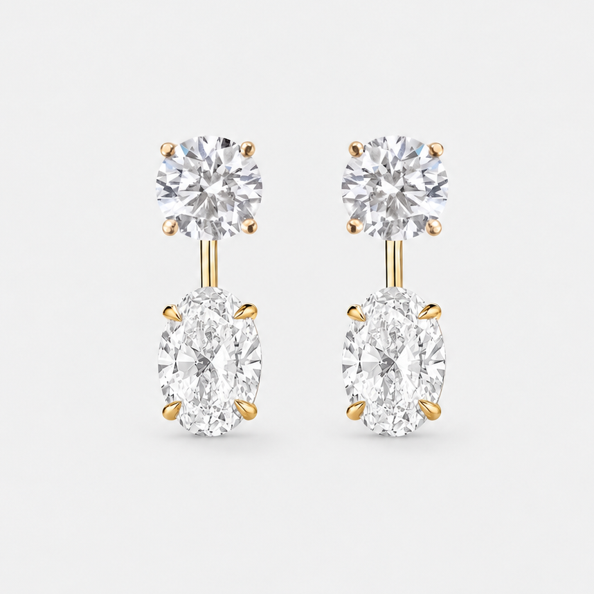 Round lab-grown diamond studs paired with oval lab-grown diamond earring jackets in 14k yellow gold.