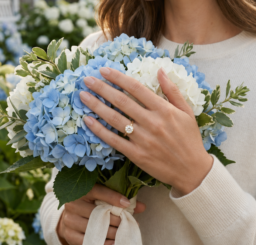 Coastal-inspired round bezel solitaire engagement ring handcrafted in solid gold