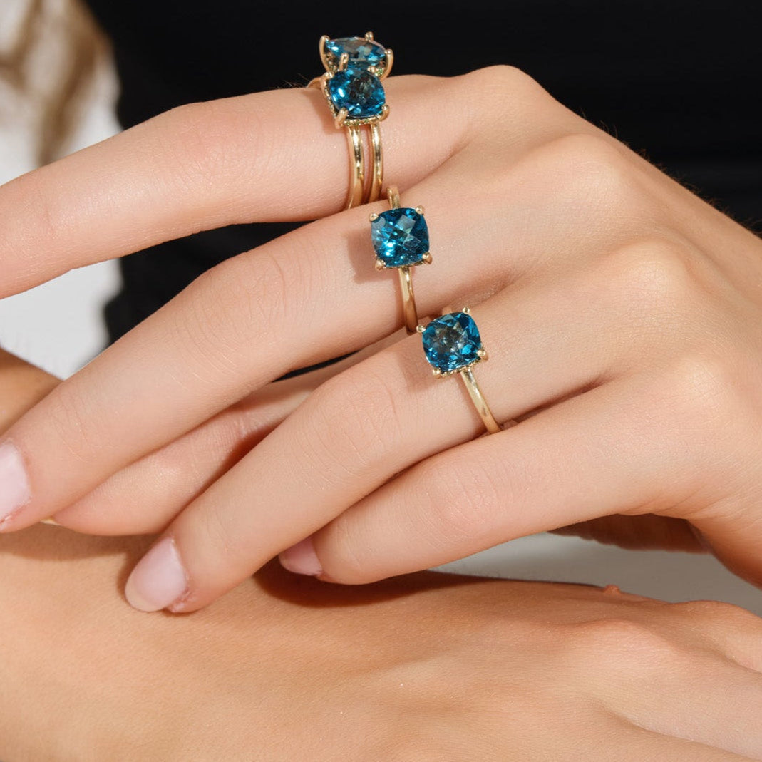 Wequassett Centennial ring in 14k gold featuring a London blue topaz center stone surrounded by a halo of lab-grown diamonds, inspired by Cape Cod coastal design