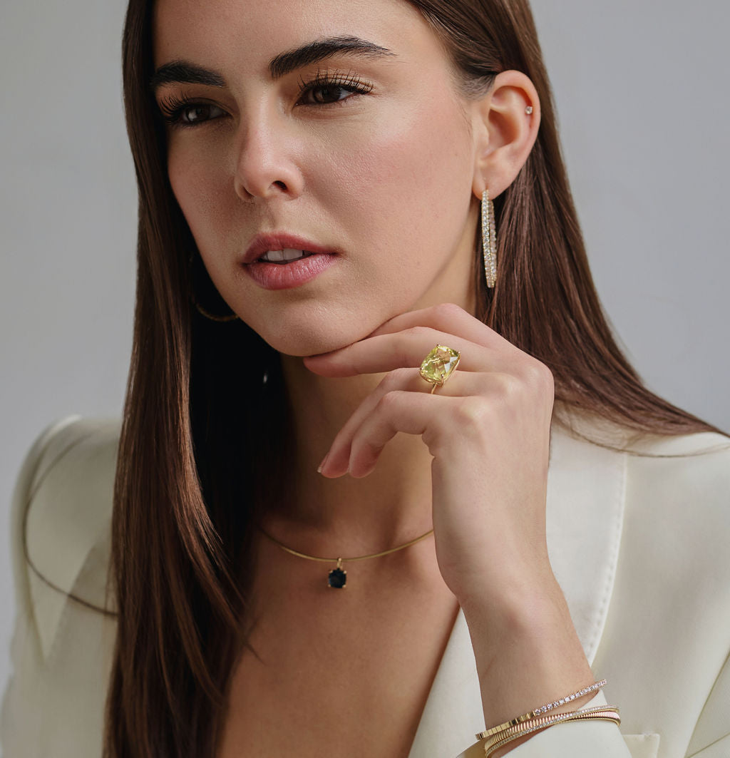 blue topaz pendant in 14k gold on thick gold chain, featuring a AAA-quality lime green gemstone in a custom basket setting with a coastal-inspired design