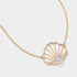 Close up details of 14K gold diamond scallop shell necklace in large size