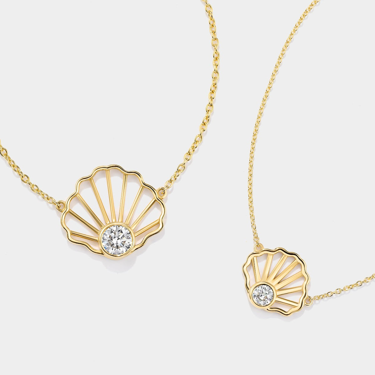 14K yellow gold scallop shell diamond necklace featuring a bezel-set diamond, inspired by the tidal flats of Cape Cod Bay.