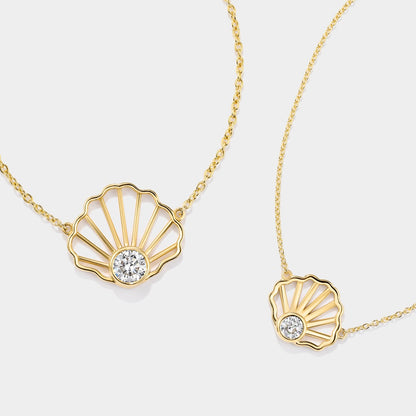 14K yellow gold scallop shell diamond necklace featuring a bezel-set diamond, inspired by the tidal flats of Cape Cod Bay.