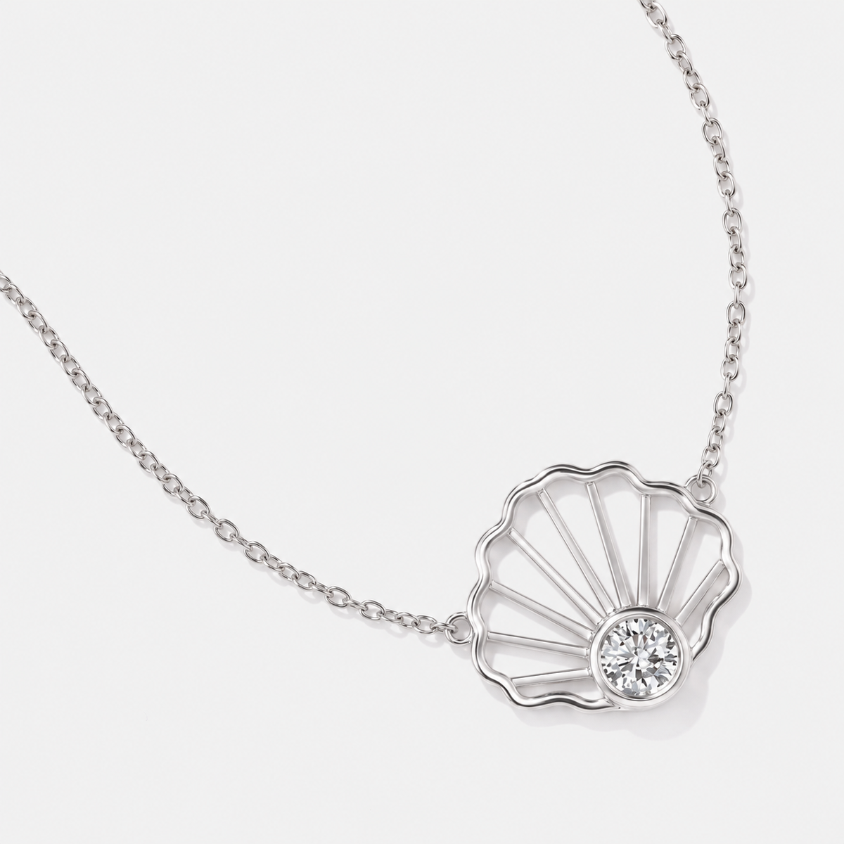 Front details of our 14K white gold diamond seashell necklace