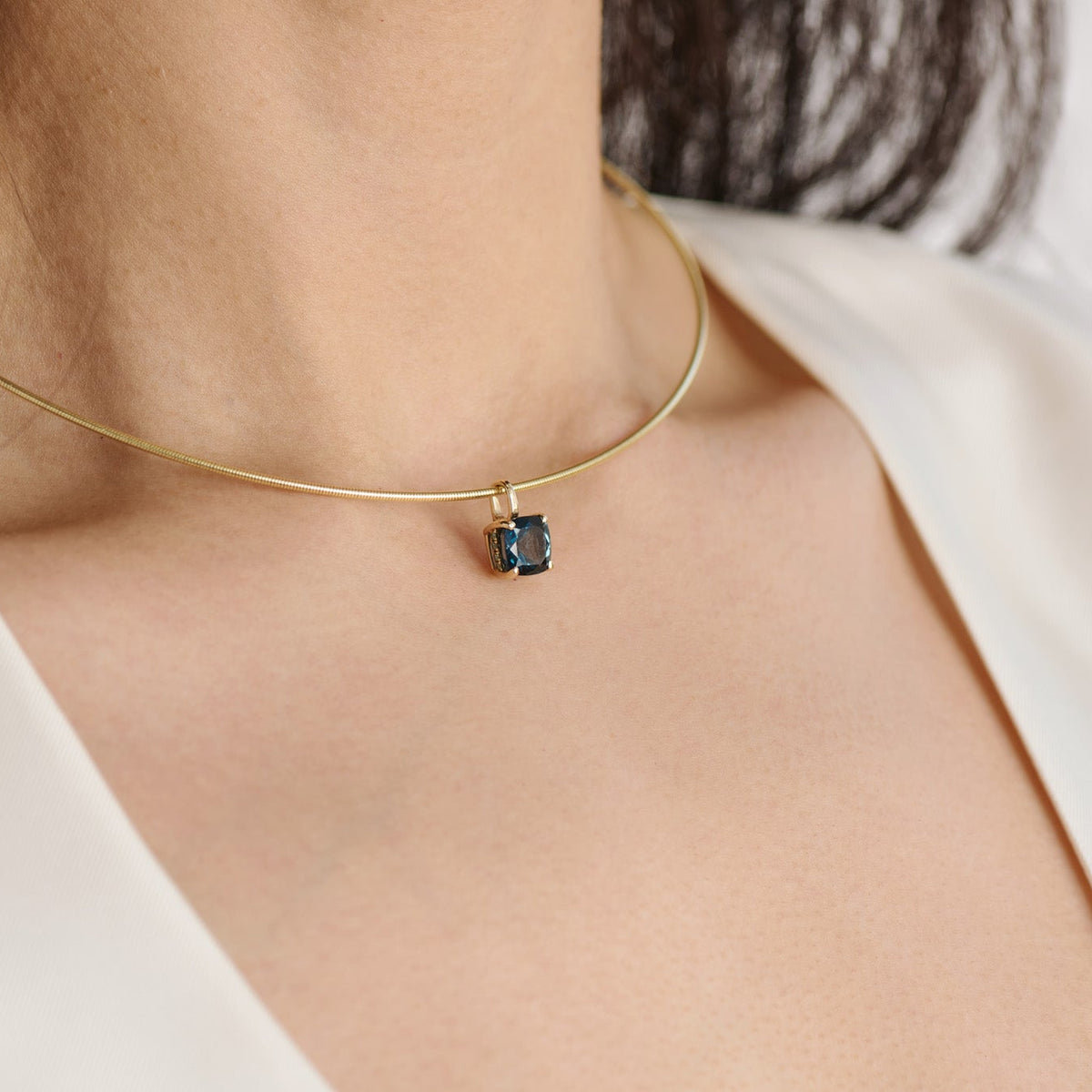 14k gold Omega necklace designed to sit along the collarbone