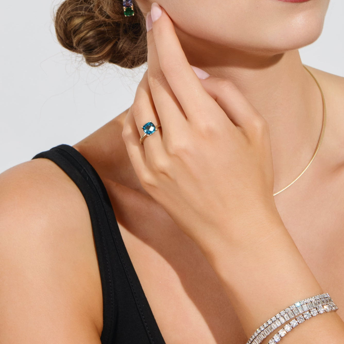Close-up of checkerboard London Blue Topaz with halo of green diamonds inspired by coastal hydrangeas