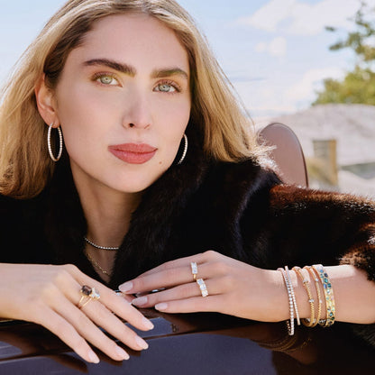 Gold Bracelets Stacked on arm