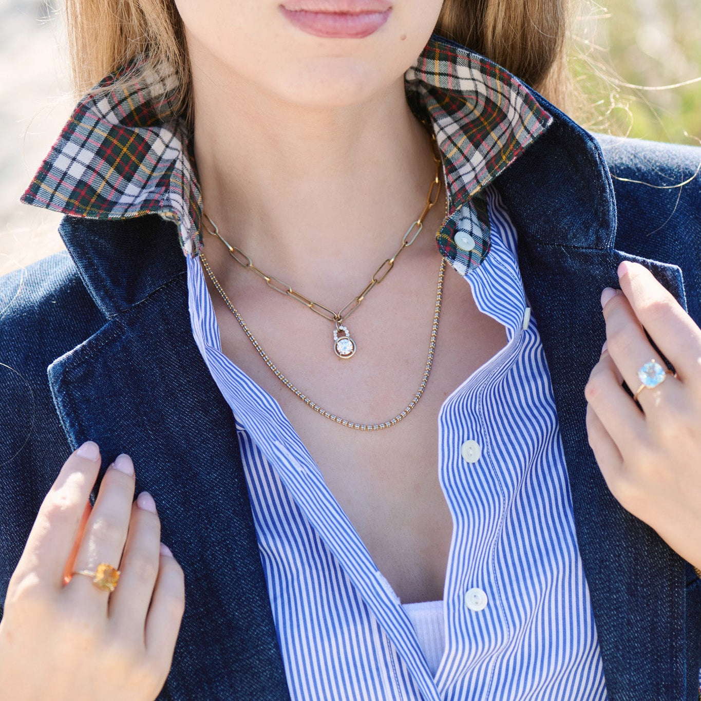 A lab grown diamond pendant with diamonds on the bail.