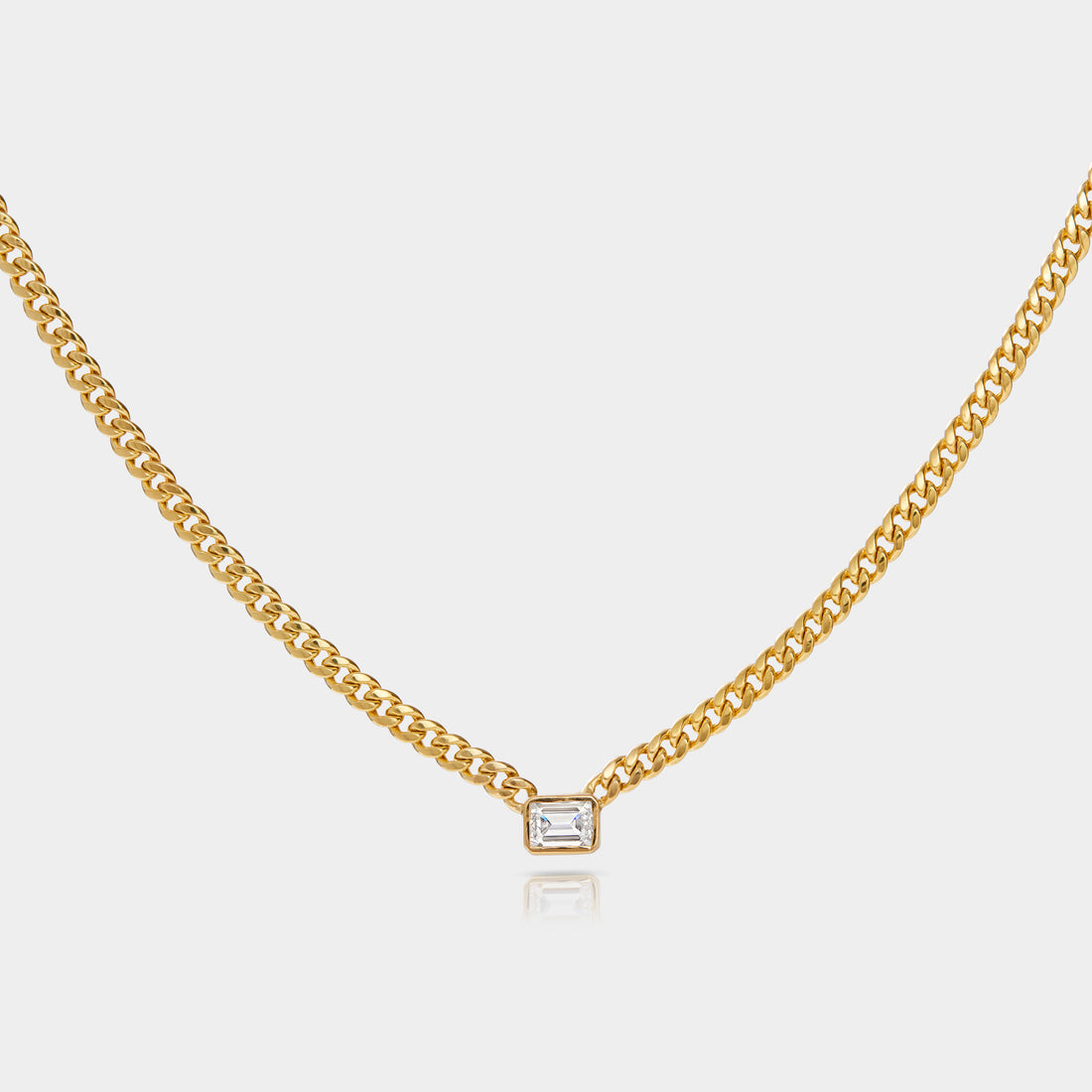a east west set lab grown diamond on a baby cuban chain. 