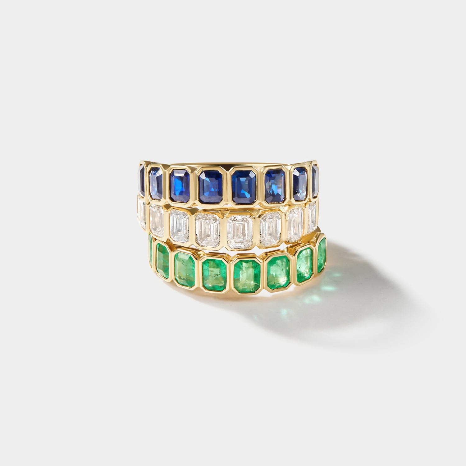 14k gold emerald bezel eternity band with lab grown emeralds