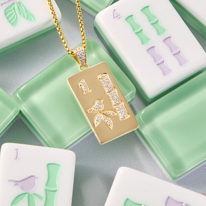 Luxury mahjong charm available in yellow gold and white gold