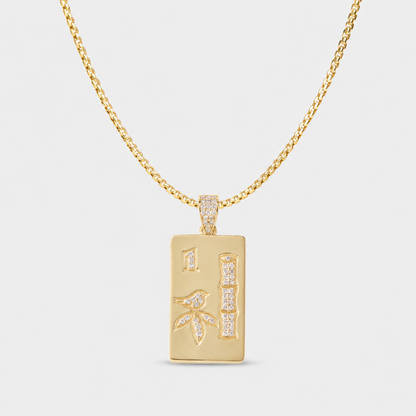 Luxury mahjong necklace in solid 14k gold with diamond details and colorful gemstone accents