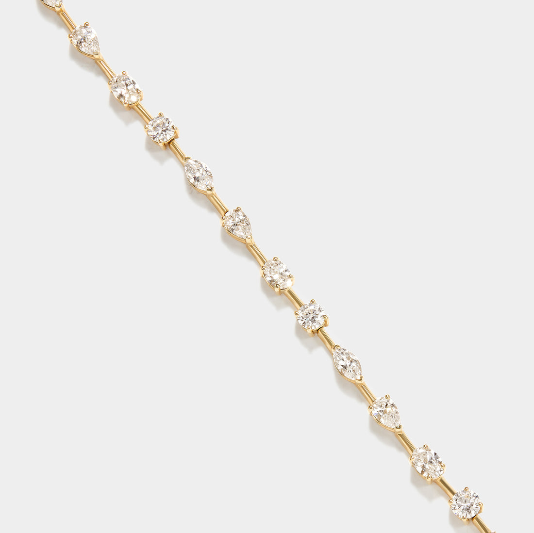 14k gold lab grown diamond tennis bracelet with marquise, pear, and round diamonds