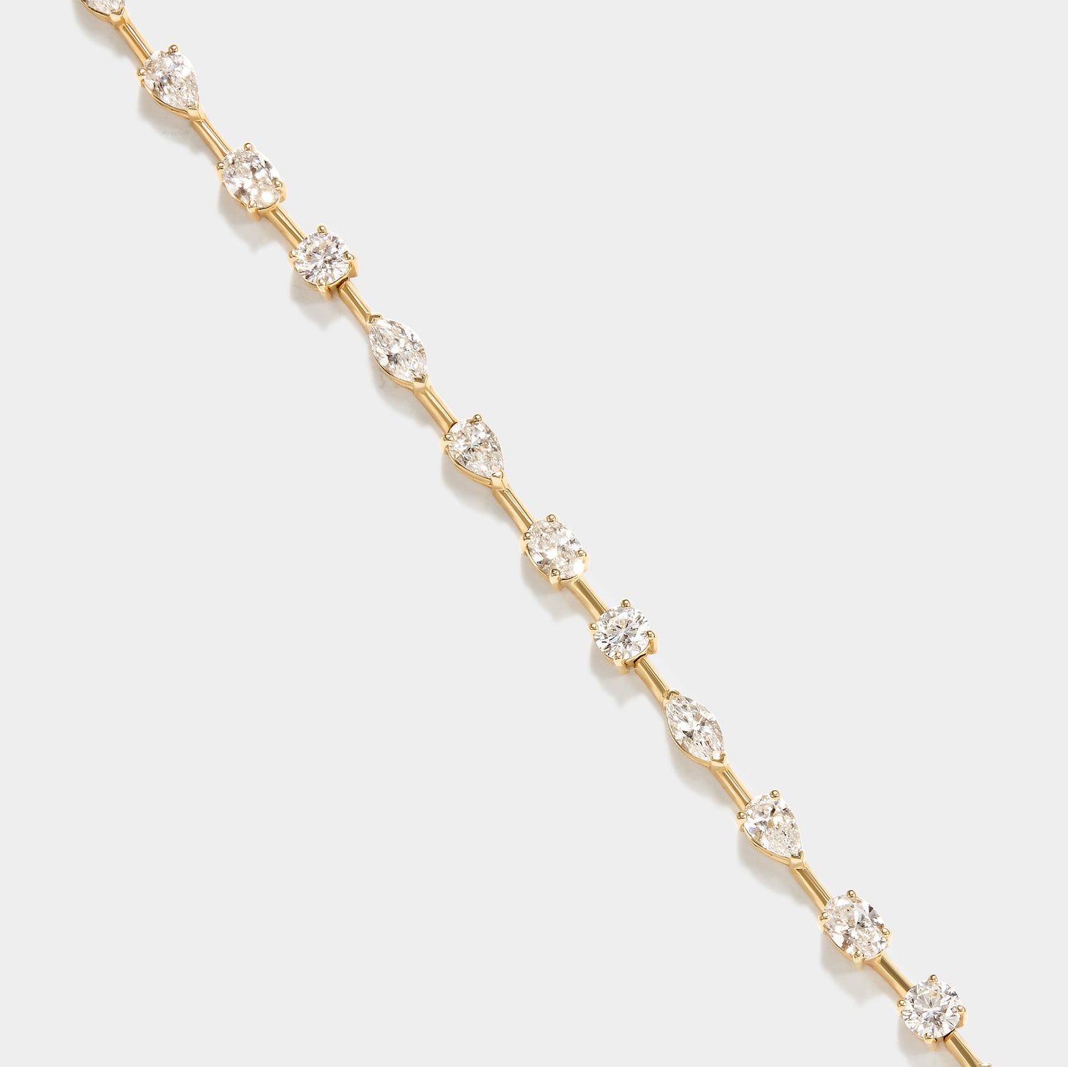 14k gold lab grown diamond tennis bracelet with marquise, pear, and round diamonds