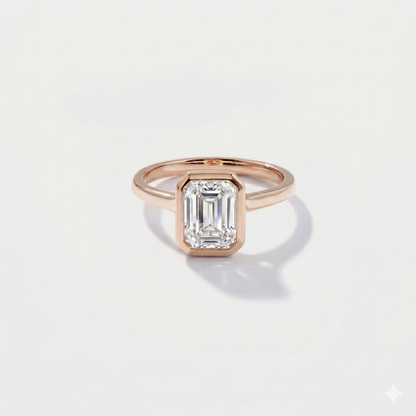 Emerald cut bezel solitaire lab-grown diamond engagement ring in 14K rose gold by Cove Fine Jewelry