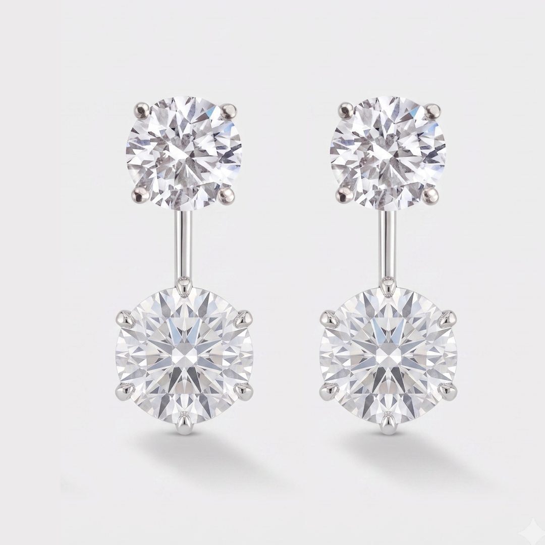 A round pair of stud earrings with a round diamond drop dangle below it. 