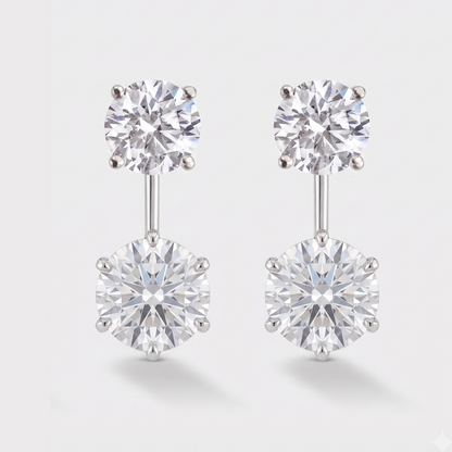 A round pair of stud earrings with a round diamond drop dangle below it. 