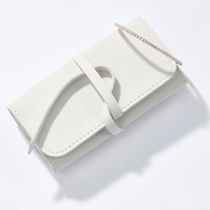 A fine jewelry travel case made of Suede.