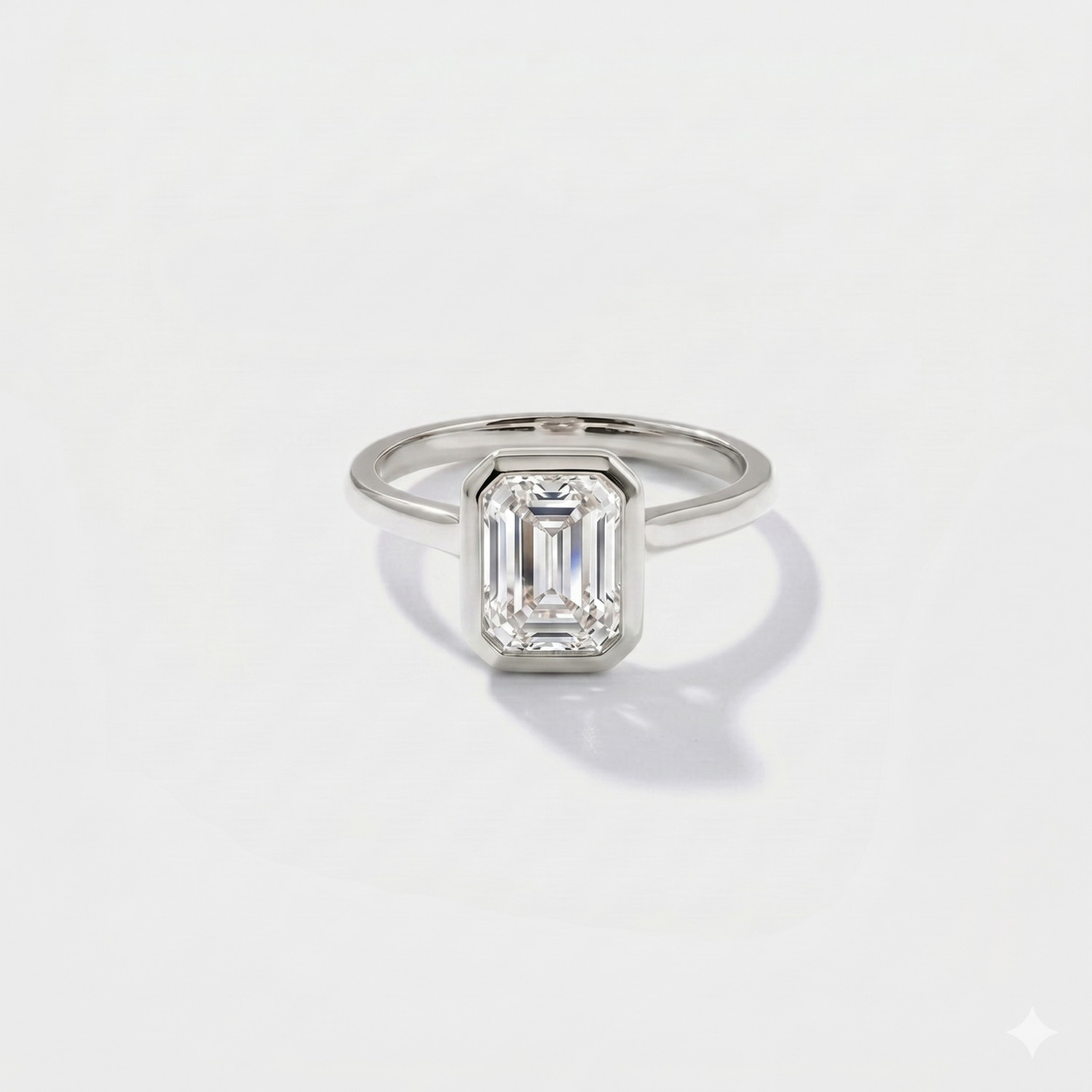 Emerald cut bezel solitaire lab-grown diamond engagement ring in 14K white gold by Cove Fine Jewelry