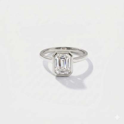 Emerald cut bezel solitaire lab-grown diamond engagement ring in 14K white gold by Cove Fine Jewelry