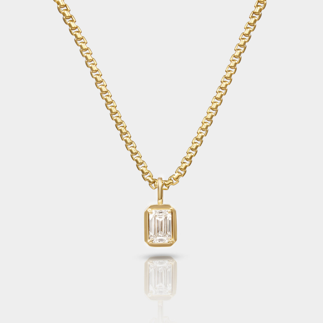 A necklace with a 14k Yellow gold Box Chain