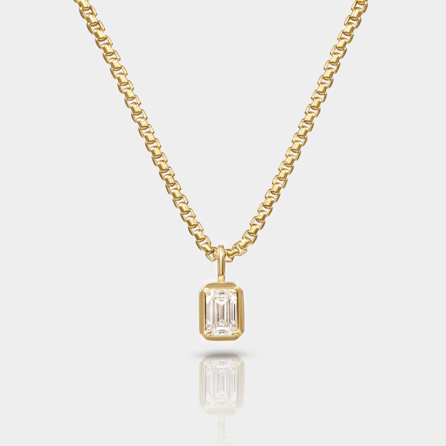 A necklace with a 14k Yellow gold Box Chain