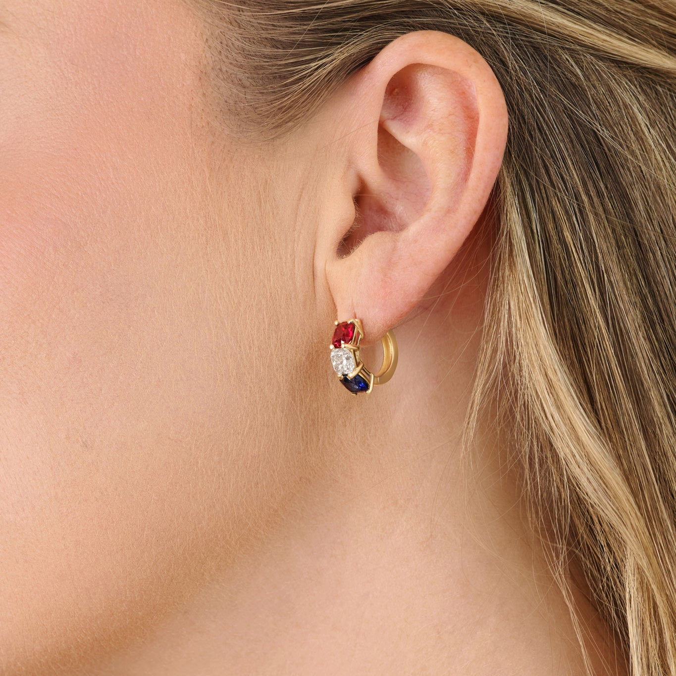 Luxury America250 jewelry featuring cushion cut diamond hoop earrings styled on model. American-made commemorative fine jewelry in solid gold.