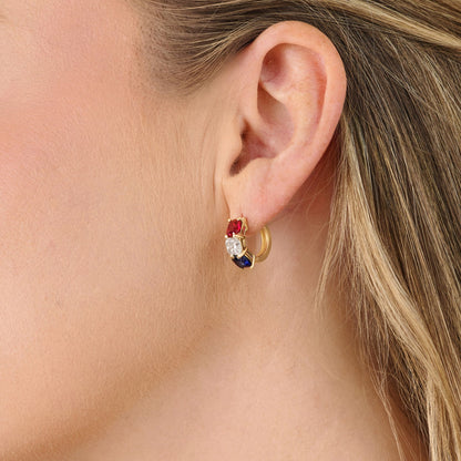 Luxury America250 jewelry featuring cushion cut diamond hoop earrings styled on model. American-made commemorative fine jewelry in solid gold.