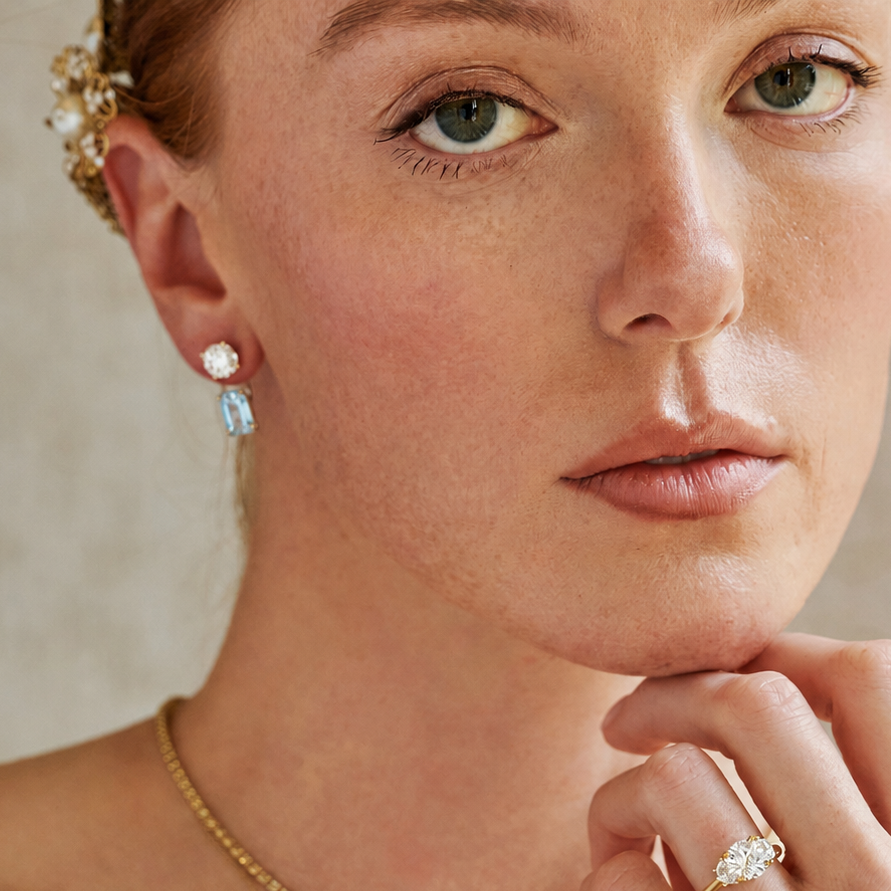 Removable aquamarine earring jackets designed to attach behind diamond studs