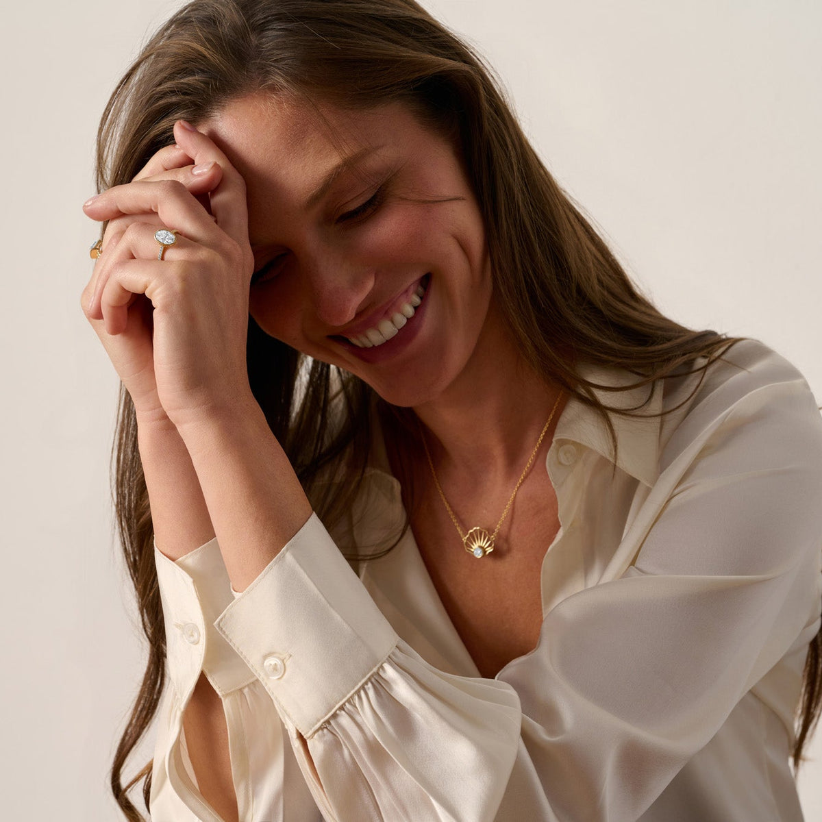 Solid 14K gold scallop shell stud earrings with lab-grown diamond, front view; Cape Cod-inspired shell jewelry.