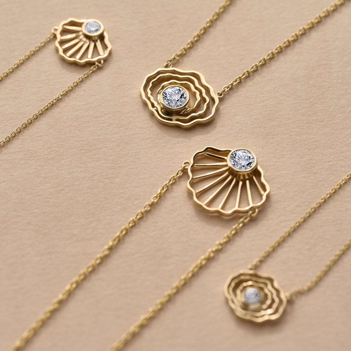 Inspired by the beaches, tidal flats, and coastal traditions of Cape Cod, our collection of solid 14K gold jewelry offers a fresh interpretation of classic Cape Cod style. Discover scallop shell pendants, oyster charms, and fine gold jewelry designed with a sense of place.