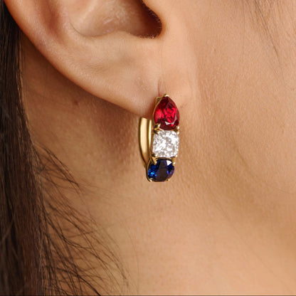Solid  gold America250 earrings with lab-grown diamonds, sapphires, and rubies styled for a modern luxury jewelry campaign.