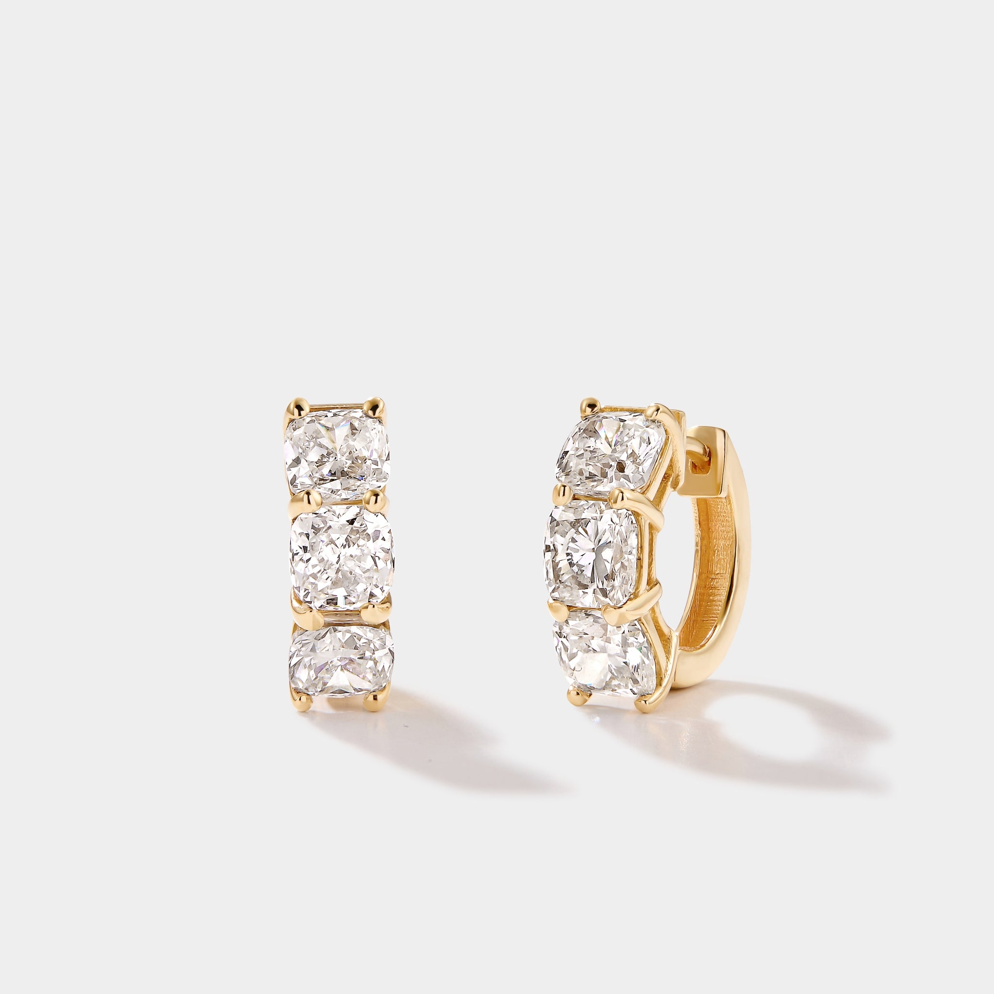 Cushion cut lab grown diamond hoop earrings in 14k gold by Cove Fine Jewelry featuring brilliant cushion diamonds in a modern luxury hoop design.