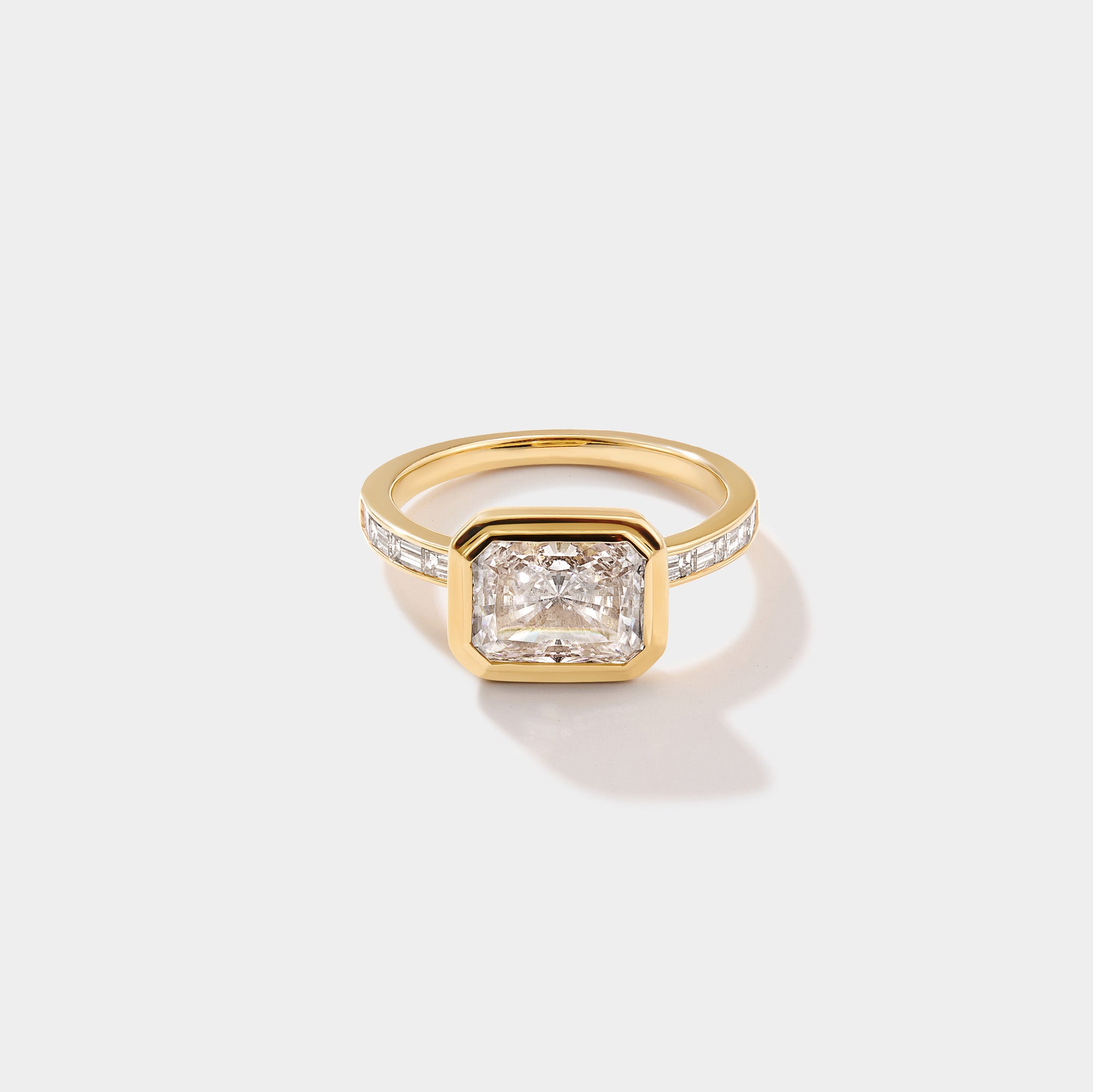 East-west solitaire lab-grown diamond engagement ring in 14K yellow gold by Cove Fine Jewelry
