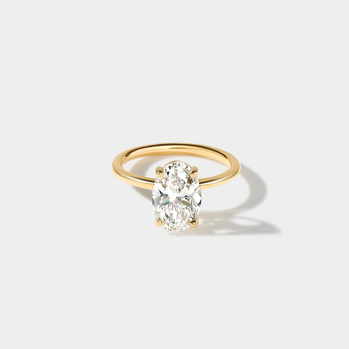 Cove elongated oval lab-grown diamond engagement ring with a delicate band and four-prong setting.