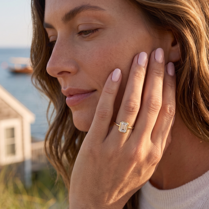 Coastal-inspired emerald cut bezel solitaire engagement ring handcrafted in solid gold