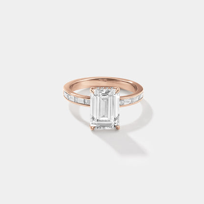 Emerald-cut lab-grown diamond engagement ring with a hidden halo and channel-set band in rose gold